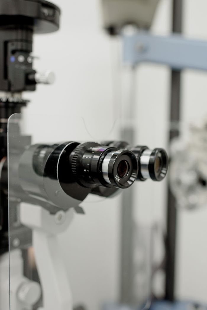 Professional medical equipment for checking refractive power of eye with protective screen in modern clinic